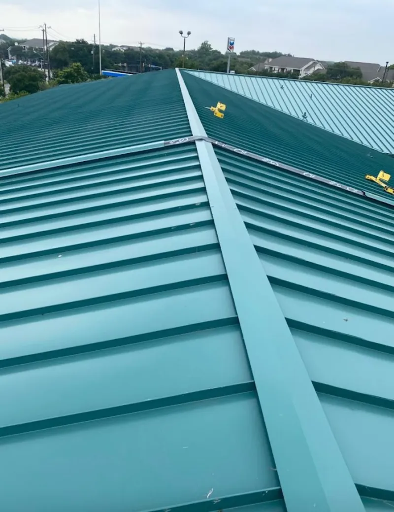 Green commercial metal roof ridge and valley for Metal Roof Repair in Emmett